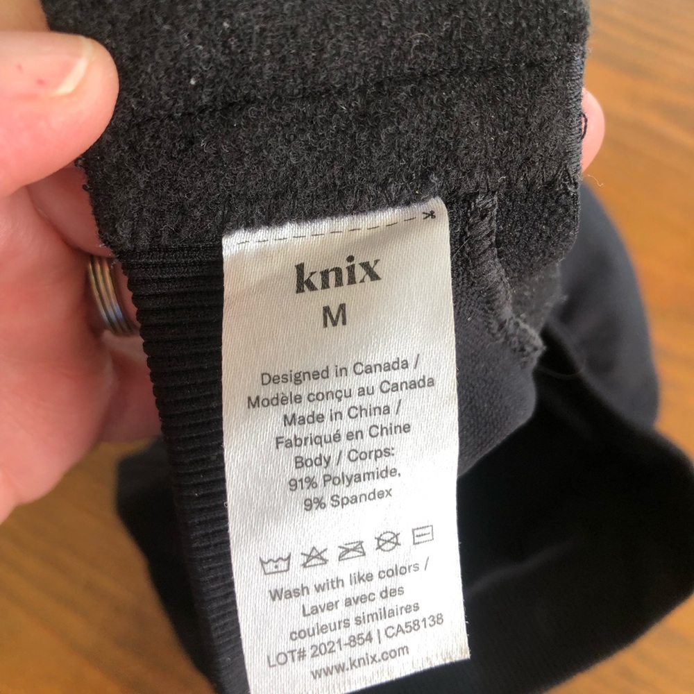 Knix brand sports bra, solid black a Medium 34B. Padded V neck bra, thin straps